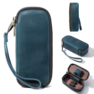 Vintage blue leather pipe pouch detail showing interior storage and wrist strap