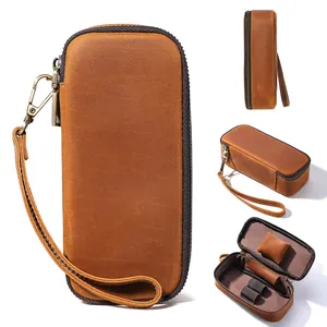 Detail view of vintage leather pipe and tobacco case with internal compartments