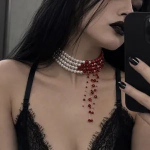 Detailed view of a Gothic Halloween choker featuring red blood drip tassels and white pearls