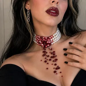 Close-up detail of Gothic blood drip tassel choker with white pearl beads for Halloween