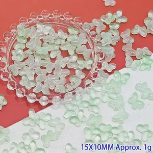 Macro view of light green gradient butterfly glass beads for DIY handmade jewelry 15x10mm