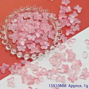 Detailed view of 15x10mm pink gradient butterfly glass beads for DIY crafts