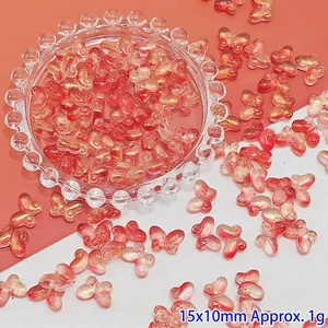 Detail of red gradient butterfly glass beads for DIY handmade jewelry crafting