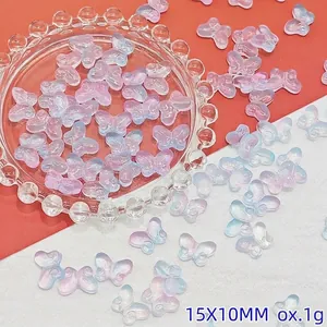 Macro view of gradient pink and blue butterfly glass beads for DIY jewelry making