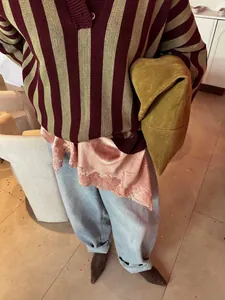 Oversized striped knit sweater for women with half-button collar in earthy autumn tones