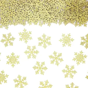 Glinsterende gouden sneeuwvlok confetti voor feestelijke kersttafel decoratie benodigdheden