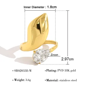 Detail view of 18K gold PVD plated stainless steel ring with large pear-cut zircon stone.