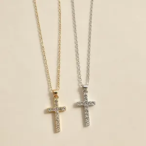 Detailed view of gold and silver full drill cross necklaces with sparkling rhinestones