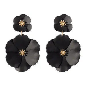 Exaggerated Bohemian style black matte flower drop earrings with golden stamen detail