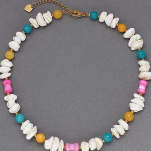 Handmade colorful beaded shell necklace featuring irregular stones for beach vacation style.