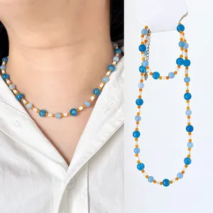 Minimalist natural stone beaded necklace and bracelet set featuring blue and orange accents