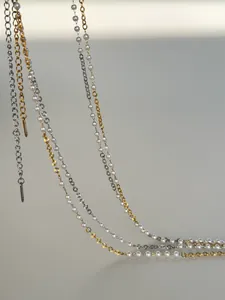 Dainty stainless steel waist chain with layered pearls and gold silver links