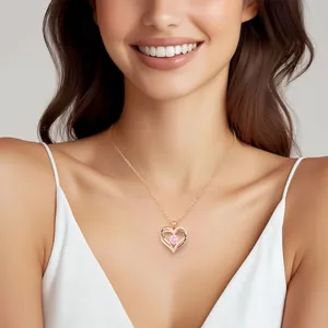 Elegant rose gold heart necklace with pink zircon pendant worn by a smiling model.
