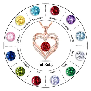 Rose gold heart pendant necklace featuring red birthstone and engraved love quote