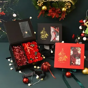Detailed view of Christmas gift boxes with transparent windows and gold foil patterns