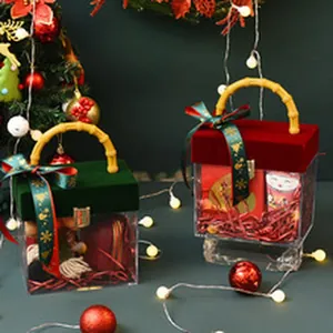 Detailed view of festive Christmas gift boxes with velvet lids and bamboo handles.