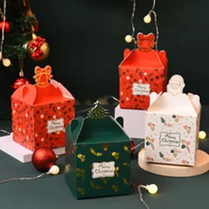 Detail of festive Christmas gift boxes in red, green and white with Merry Christmas labels