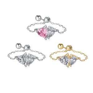 Detail of elegant chain rings featuring heart-shaped cubic zirconia in various finishes