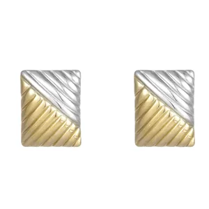 Macro detail of two-tone square stainless steel earrings with elegant ribbed texture