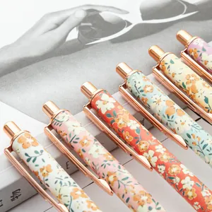 Creative floral pattern retractable ballpoint pens with elegant rose gold metal accents