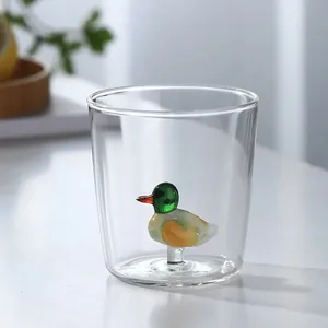 Detailed view of 3D glass duck figurine inside a clear glass drinking cup