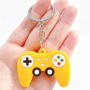 Detail view of a creative yellow silicone game controller keychain with metal ring.
