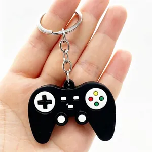 Detailed view of a mini black soft rubber game controller keychain for bags