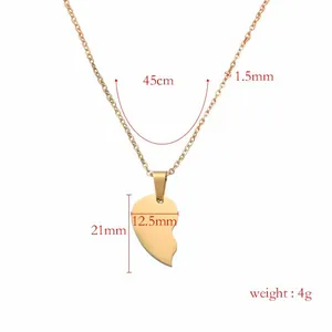 Macro view of a gold-plated split heart pendant necklace with full product dimensions.
