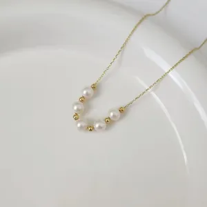Natural 5-6mm freshwater pearl smile necklace in gold finish over S925 silver