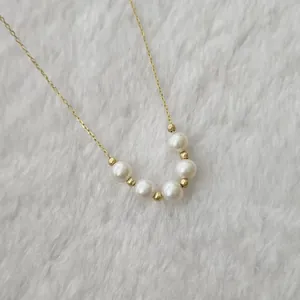 Elegant natural freshwater pearl smile necklace with 5-6mm round pearls on gold chain