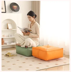 Comfortable thickened square floor cushions in green and orange for indoor meditation