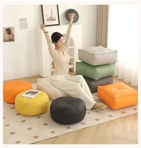 Woman relaxing on colorful round and square thickened floor cushions in a cozy room