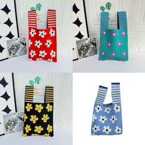 Collection of four colorful floral knitted vest tote bags with striped handle design