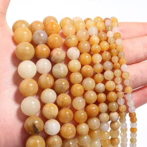 Détail des perles rondes en topaze jaune naturelle de tailles variées pour bijoux DIY