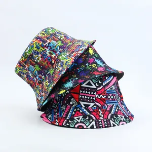 Close-up of three stacked bucket hats featuring graffiti, splatter, and tribal prints.