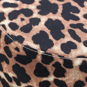 Close-up of high-quality stitching and suede texture on leopard print bucket hat
