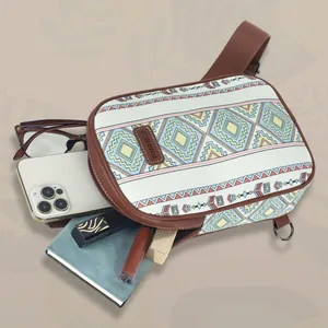 Detailed view showing large storage capacity of ethnic canvas waist bag with daily essentials
