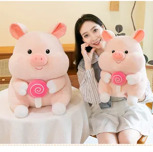 Detailed shot of cute pink pig plush toys with lollipops, perfect as birthday gifts for kids.