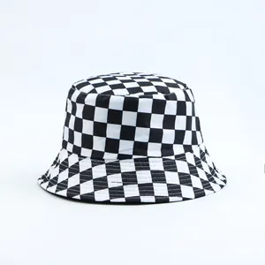 Detailed view of a classic black and white checkered checkerboard bucket hat for women