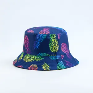 Detailed view of navy blue bucket hat featuring colorful pineapple print patterns