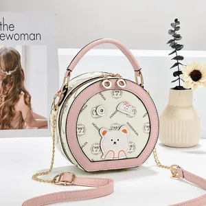 Petit sac à bandoulière rond élégant pour femme avec motif ours et bordure rose