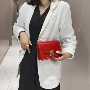 Stylish red small square crossbody bag with metallic chain and golden lock for women