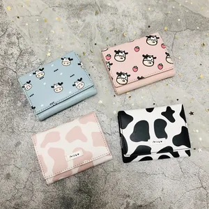 Collection of cute cartoon cow and milk print tri-fold mini wallets in multiple colors