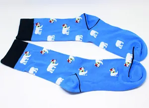 Close-up of blue cotton crew socks featuring festive cartoon polar bear pattern
