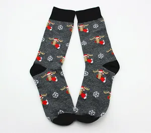 Detailed view of festive grey Christmas crew socks featuring cartoon moose and snowflake patterns