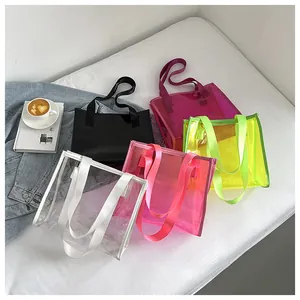 Detailed view of colorful transparent PVC jelly tote bags in various vibrant colors