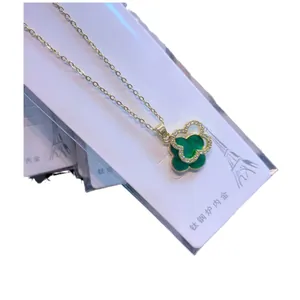 Gold-plated titanium steel four-leaf clover necklace with green inlay and crystal border