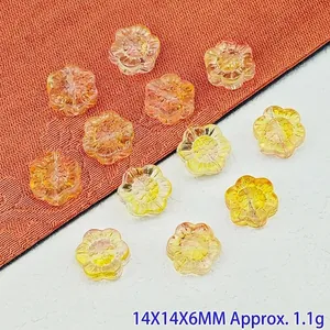 Detailed macro view of 14mm sunflower-shaped gradient glass beads for DIY jewelry