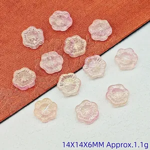 Close-up of 14mm translucent pink sunflower glass beads for DIY jewelry accessories