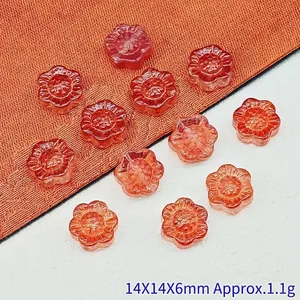 Close-up of 14mm orange sunflower glass beads for DIY jewelry making projects and crafts